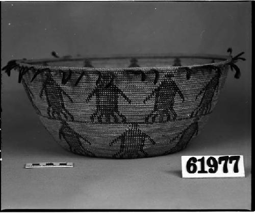 Food or mush bowl with red wool and quail feathers, from unknown collection. Coiled, bundle foundation, non-interlocking stitches, clockspring start.