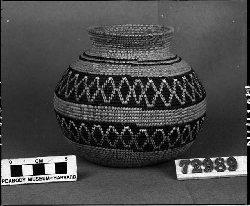 Bottleneck basket made by George's wife's mother, ca. 1878. From the collection of C. Hartman. Coiled with quill decoration.