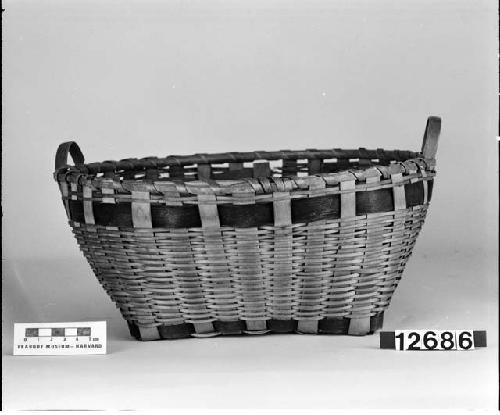 Round basket with handles. From the collection of the brothers of Mrs. J.M. Robinson, 1883-1925. Plain plaited.