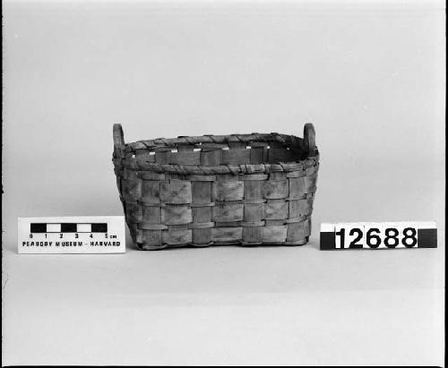 Rectangular basket with handles. From the collection of the brothers of Mrs. J.M. Robinson, 1883-1925. Plain plaited.