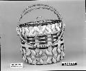 Sewing basket made by Donald and Mary Sanipass. From the collection of C. Walsh. Plaited with ornamental "curled" strips.