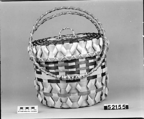 Sewing basket made by Donald and Mary Sanipass. From the collection of C. Walsh. Plaited with ornamental "curled" strips.