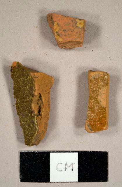 Refined redware sherd with honey-colored lead glaze on interior and black lead glaze on exterior