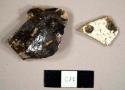 Miscellaneous brown and white stoneware sherds, burned and one possibly molded