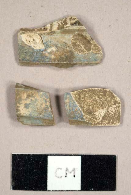 Earthenware sherds with molded band and blue underglaze decoration, possibly burned