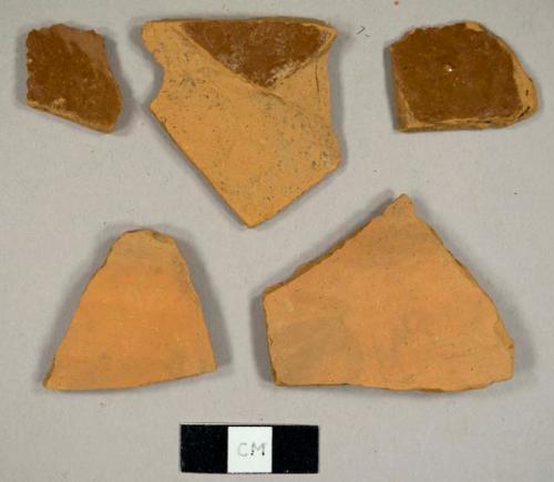 Unglazed and lead glazed refined redware sherds