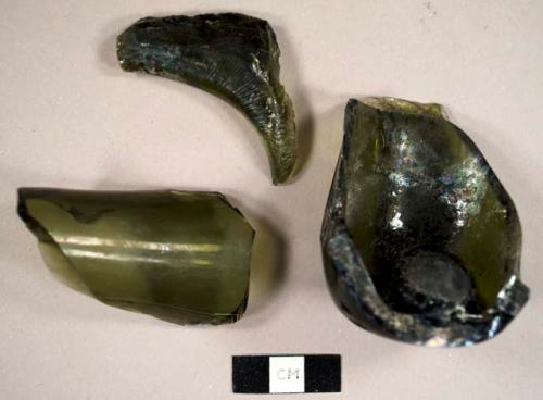 Olive green bottle glass fragments, including partial bottle base