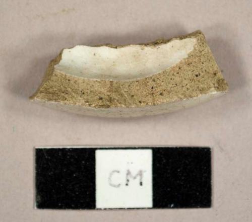 White lead glazed, grey bodied stoneware base sherd of a mug