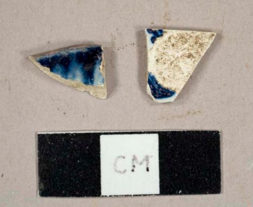 Blue and white pearlware sherds, including one shell-edged plate rim sherd