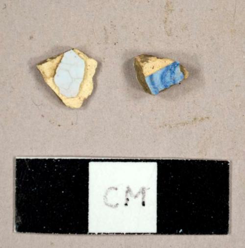 Tin glazed earthenware sherds, including one with handpainted blue on blue decorations