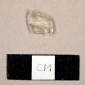 Colorless bottle glass fragment, possibly with a fragment of an embossed letter