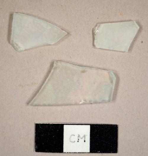 Flat colorless glass fragments, possibly frosted