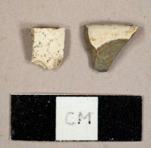 White kaolin pipe bowl fragments, one burnt