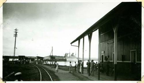 Scan of photograph from Judge Burt Cosgrove photo album.Puerto Barrios S.S. Tela at dock along side banana sheds-Railroad ticket office in foreground. January 17 1938