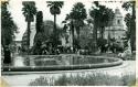 Scan of photograph from Judge Burt Cosgrove photo album.Pool in Plaza Band shell and Cathedral in background