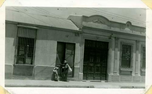 Scan of photograph from Judge Burt Cosgrove photo album.Across the avenue from the office.