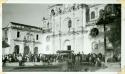 Scan of photograph from Judge Burt Cosgrove photo album.Fiesta crown in front of La Merced