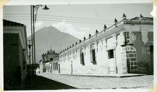 Scan of photograph from Judge Burt Cosgrove photo album.Street in Antigua-Agua in background