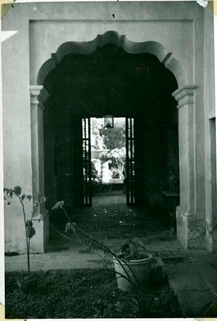 Scan of photograph from Judge Burt Cosgrove photo album.Looking toward fountain from dining room patio