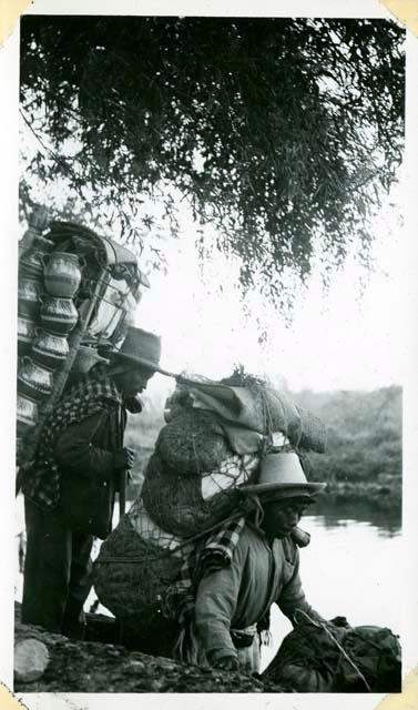 Scan of photograph from Judge Burt Cosgrove photo album.Taking the boat at Tzanjuhu for the markets across the lake