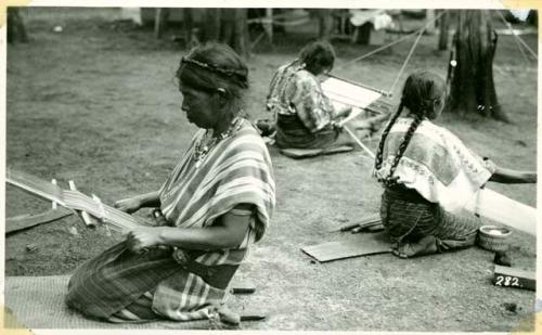 Scan of photograph from Judge Burt Cosgrove photo album.women weaving
