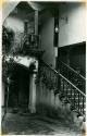 Scan of photograph from Judge Burt Cosgrove photo album.Stairway in Mayan Inn Chichicastenango