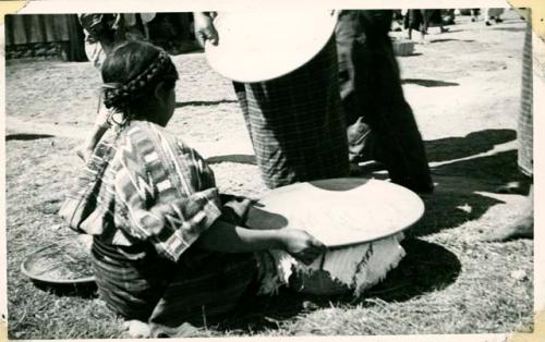 Scan of photograph from Judge Burt Cosgrove photo album. Pottery for sale