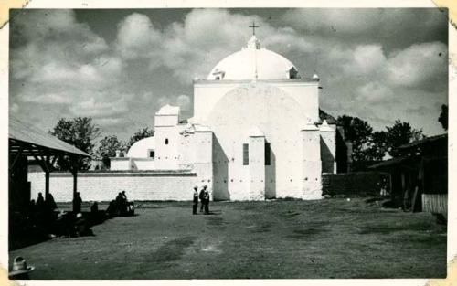 Scan of photograph from Judge Burt Cosgrove photo album.Back of church-foreground is part of market lot