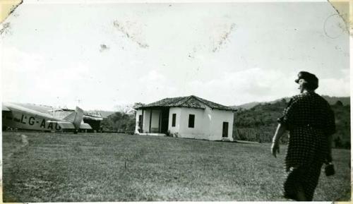 Scan of photograph from Judge Burt Cosgrove photo album. TAAC airport Copan-Honduras Mrs.Williams