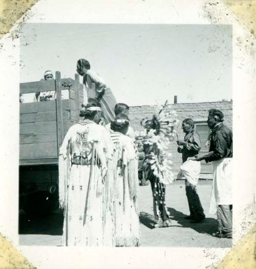 Scan of photograph from Judge Burt Cosgrove photo album. Getting ready for the parade