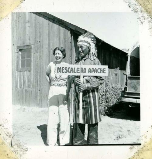 Scan of photograph from Judge Burt Cosgrove photo album.Indian Tribal Ceremonial. Mildred and Chief

