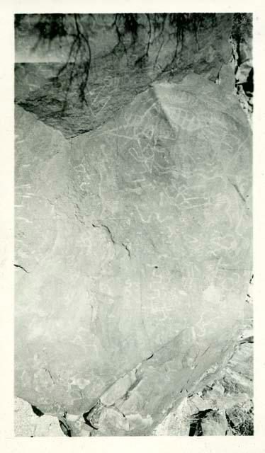 Scan of photograph from Judge Burt Cosgrove photo album.Petroglyphs near Tonuco, New Mex. below Rincon

