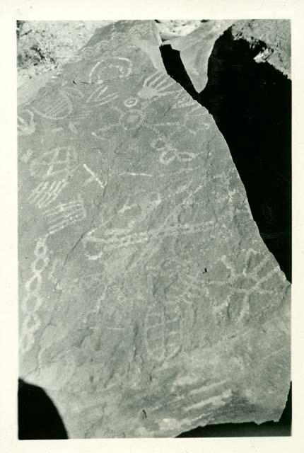 Scan of photograph from Judge Burt Cosgrove photo album.Petroglyphs near Tonuco, New Mex. below Rincon
