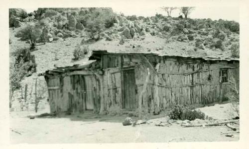 Scan of photograph from Judge Burt Cosgrove photo album. Mexican Jacal Mimbres valley New Mex.