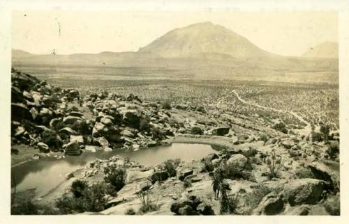 Scan of photograph from Judge Burt Cosgrove photo album.Wind mountain To south from Cornudas del Alamo Old Butterfield trail at right.

