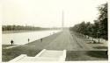 Scan of photograph from Judge Burt Cosgrove photo album. Washington Monument to east from Lincoln Memorial