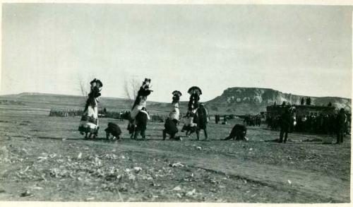 Scan of photograph from Judge Burt Cosgrove photo album.Koshari Dancers, Zuni Pueblo, New Mex.