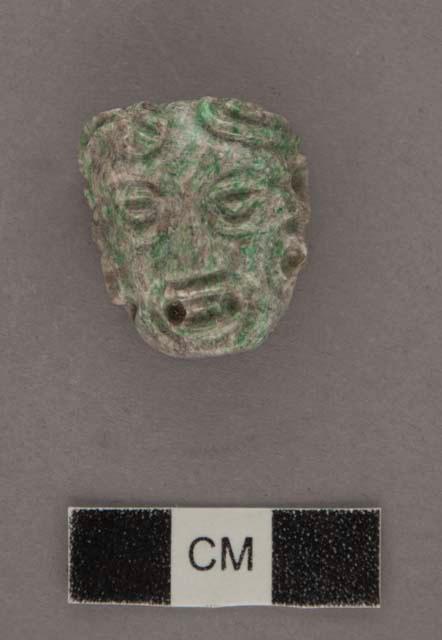 Carved jadeite ornament, human face