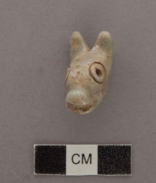 Ground stone; effigy, zoomorphic; perforated; eyes incised