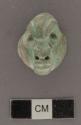 Carved jadeite ornament, human face