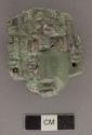 Portion of carved jadeite ornament, human face