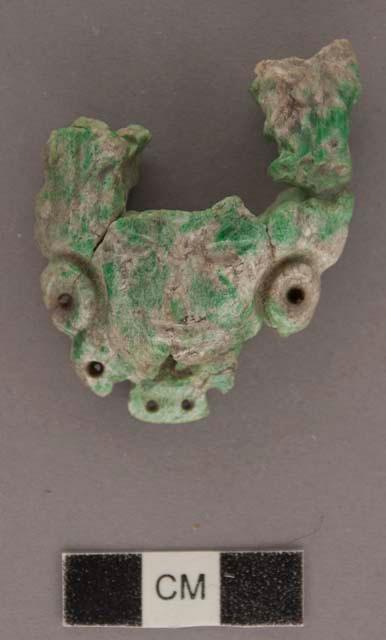 Portion of carved jadeite ornament, human face