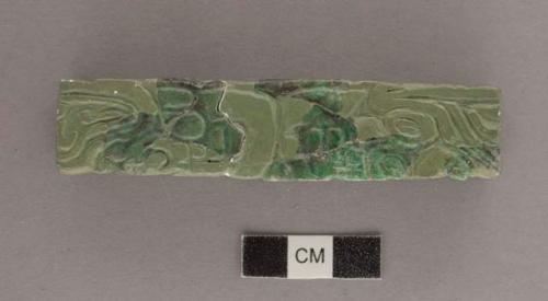 Three fragments of carved greens and grays jade tubular bead