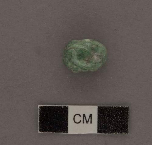 Fragment of decorated jade bead - one half missing