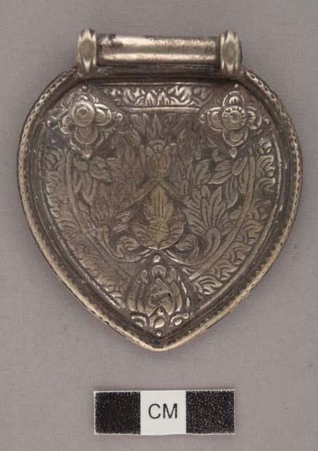 Repousse silver pubic ornament - decorated with floral patterns +