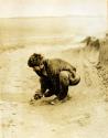 Sameul Lothrop looking over a shell heap S. of Rio Fuego