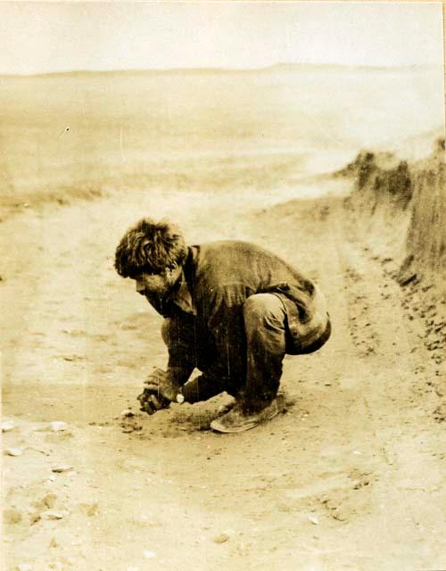 Sameul Lothrop looking over a shell heap S. of Rio Fuego