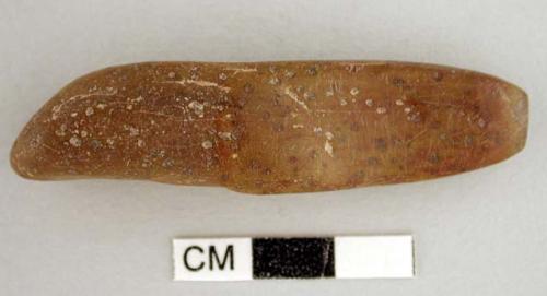 "chisel", elongated, irregular pebble, 1 sharpened chisel-like end; bit is thin,