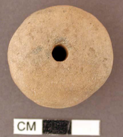 Discoidal spindle whorl with central bore (through height) & groove around circu