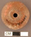 Spindle whorl. "turbinated". finished by polishing. convex base, medial shoulder